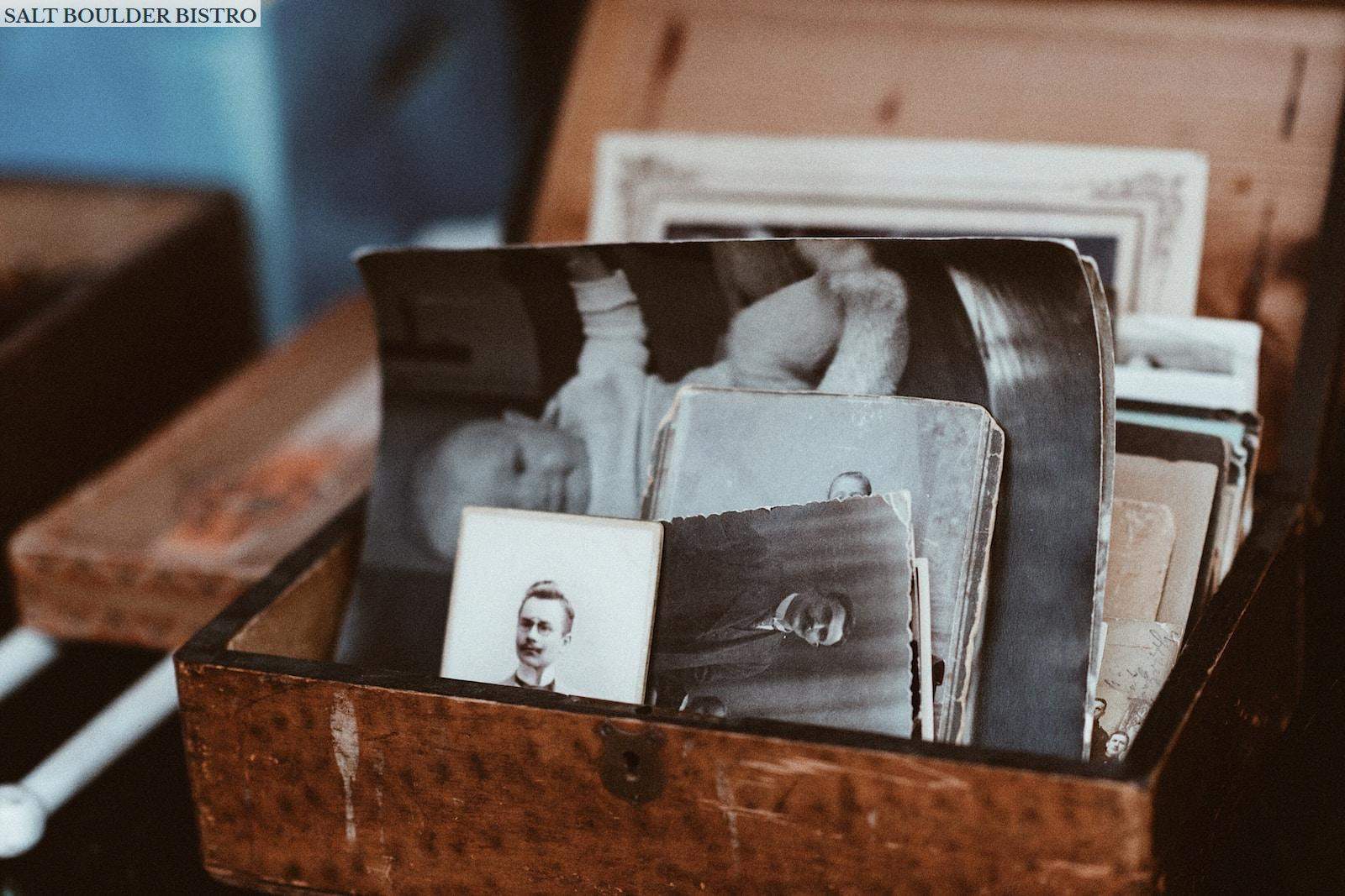 old photos in brown wooden chest