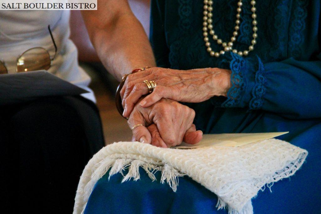 person wearing gold ring and blue dress